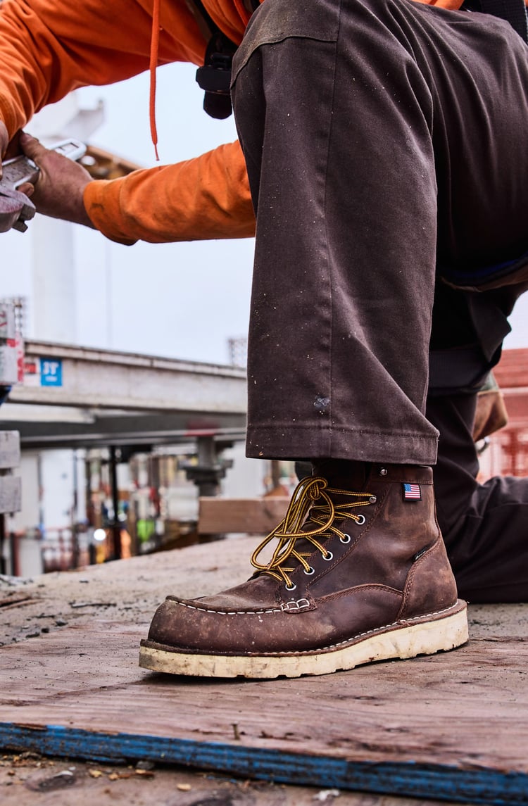 pair of work boots at a construction project