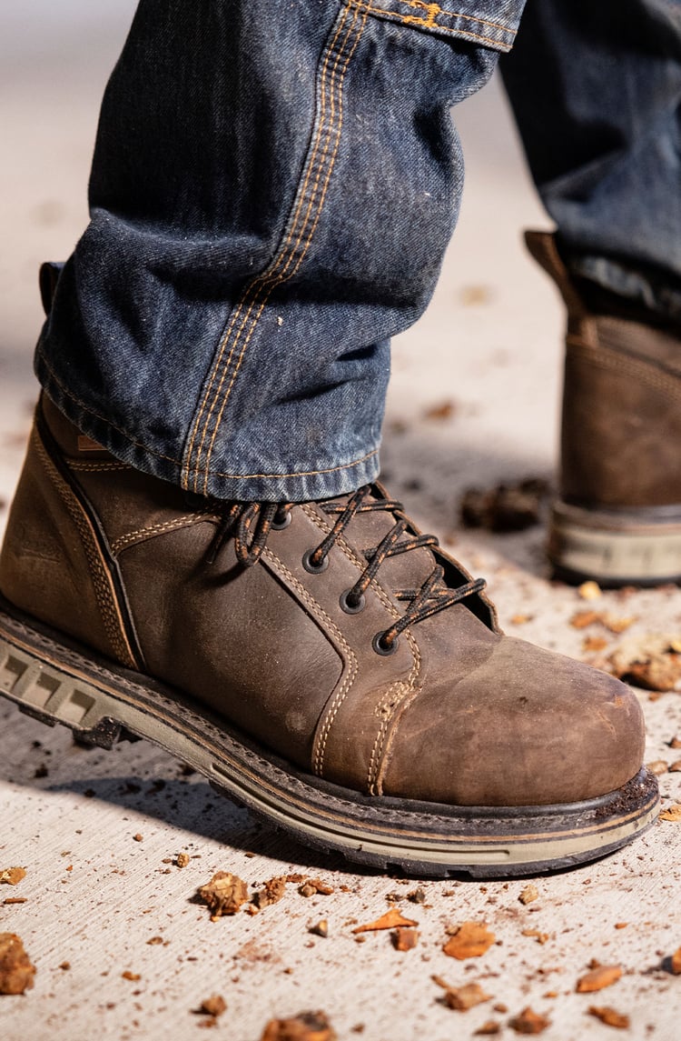 A pair of hiking shoes in black, white, and yellow