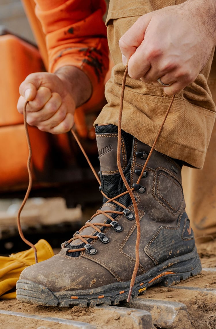 pair of work boots at a construction project