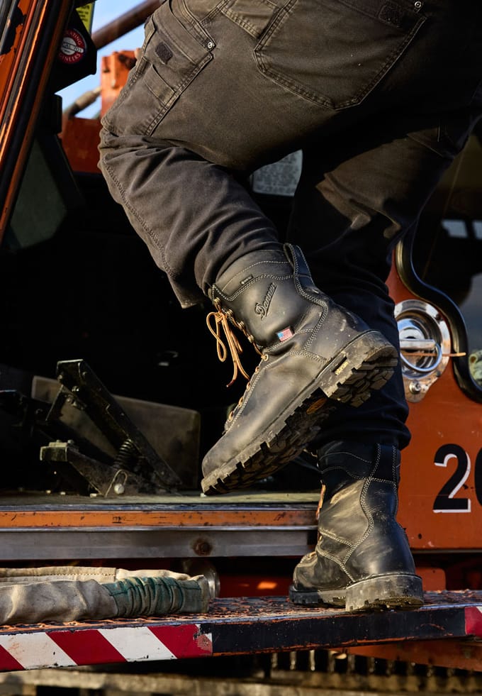 entering equipment while wearing black work boots