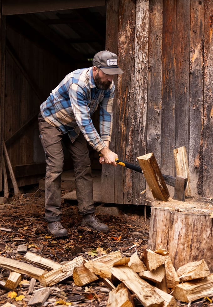 A man splitting wood