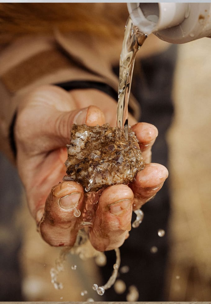 pouring water on a rock