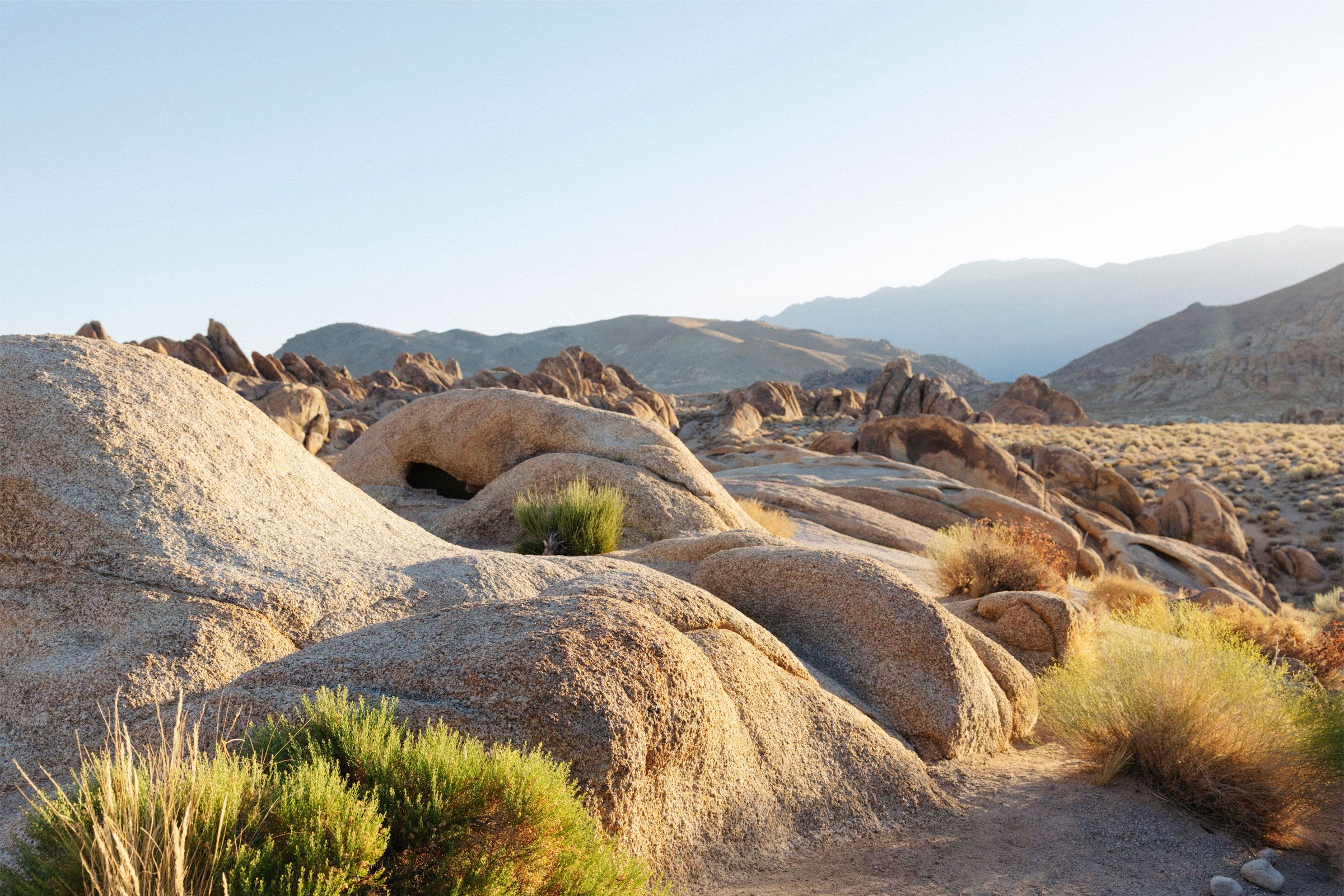 a man kneeling down in camo