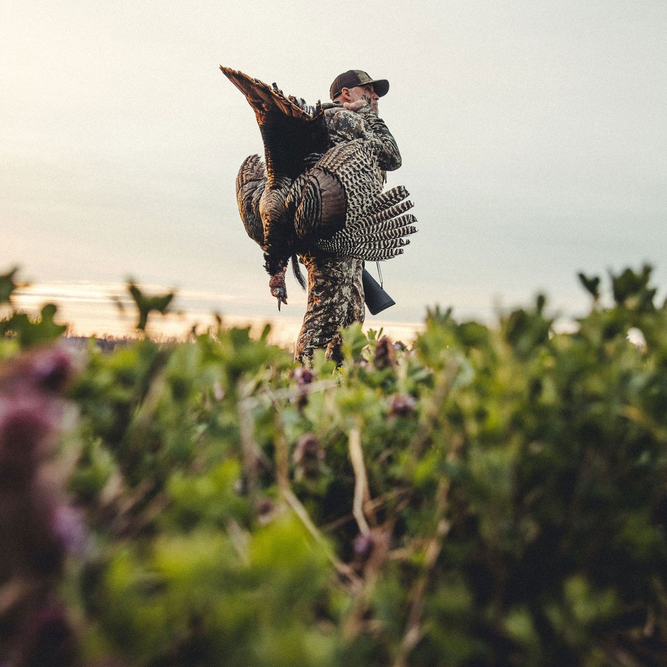 a man carrying a turkey