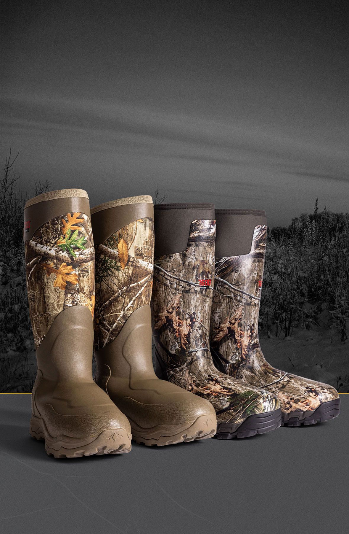 Three pairs of rubber hunting boots against black and white trees