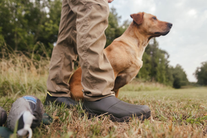 A dark brown leather boot shown in profile with some dirt showing on the light gray midsole and black outsole.