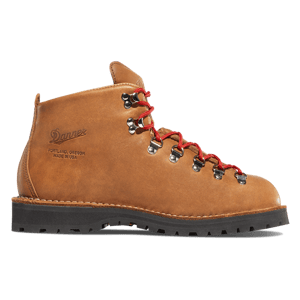 A dark brown leather boot shown in profile with some dirt showing on the light gray midsole and black outsole.