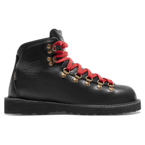 A dark brown leather boot shown in profile with some dirt showing on the light gray midsole and black outsole.