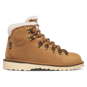 A brown leather boot shown in profile view with yellow textile inlays, there are dirt smudges on the toe and sides of the boot.